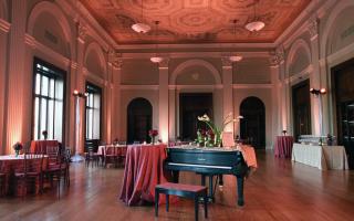 fancy room with tables and piano