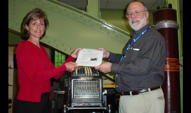 Photo of Adding Machine being Accessioned