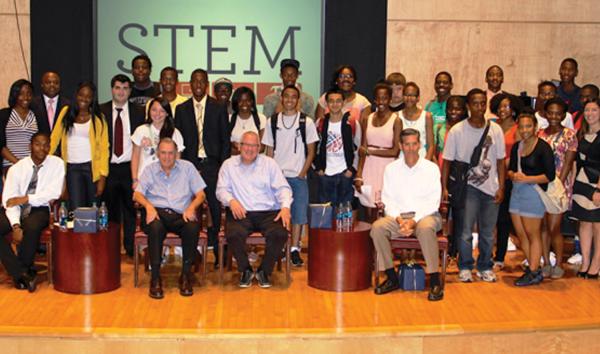 STEM students gathered for a photo on the stage of Musser Theater at The Franklin Institute.