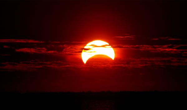 Partial Solar Eclipse occurring at sunrise