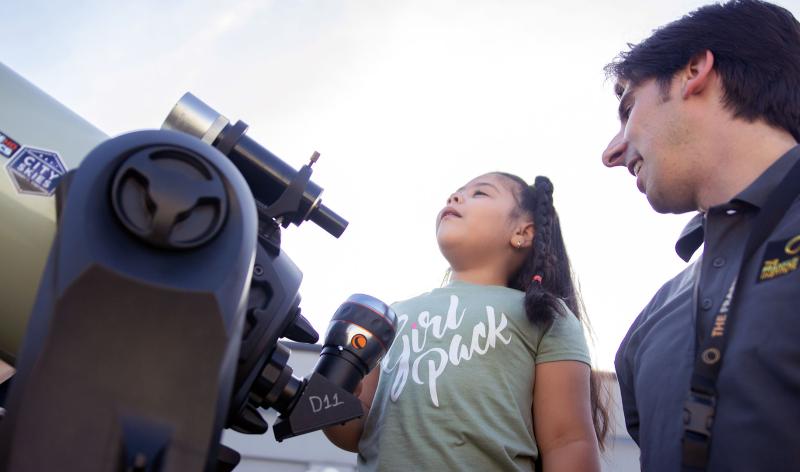 child with telescope
