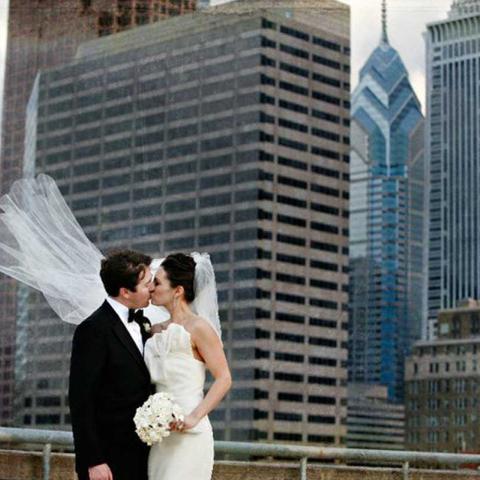 A wedding ceremony being held on the rooftop deck of The Franklin Institute.