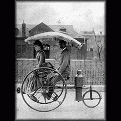 People riding in first automobile.