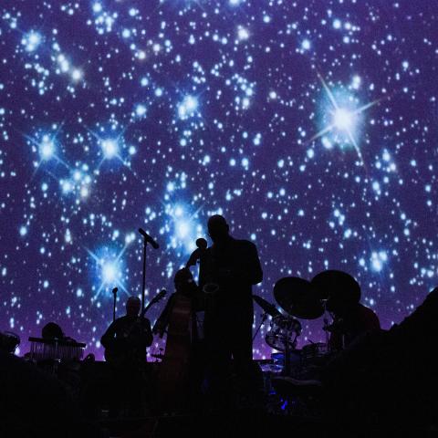 A live band performs at an event in the Fels Planetarium