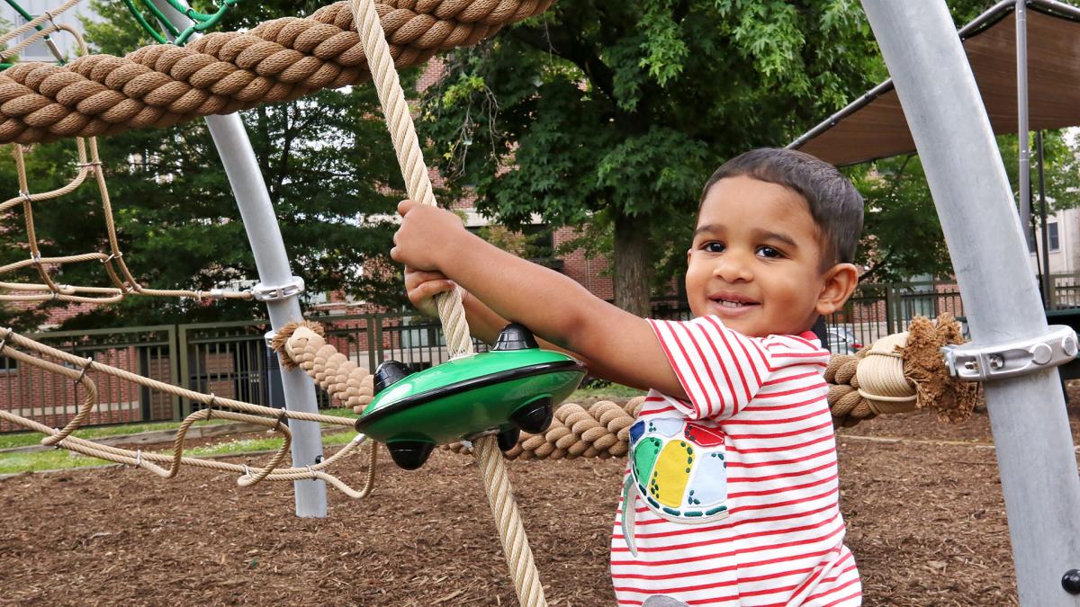 a smiling child in science park